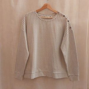 Grey and white sweater with buttoned detailing